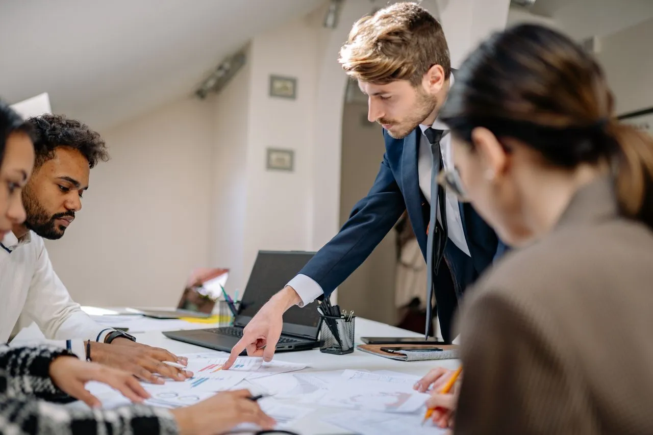 Hiring manager reviewing pre-employment screening process results
